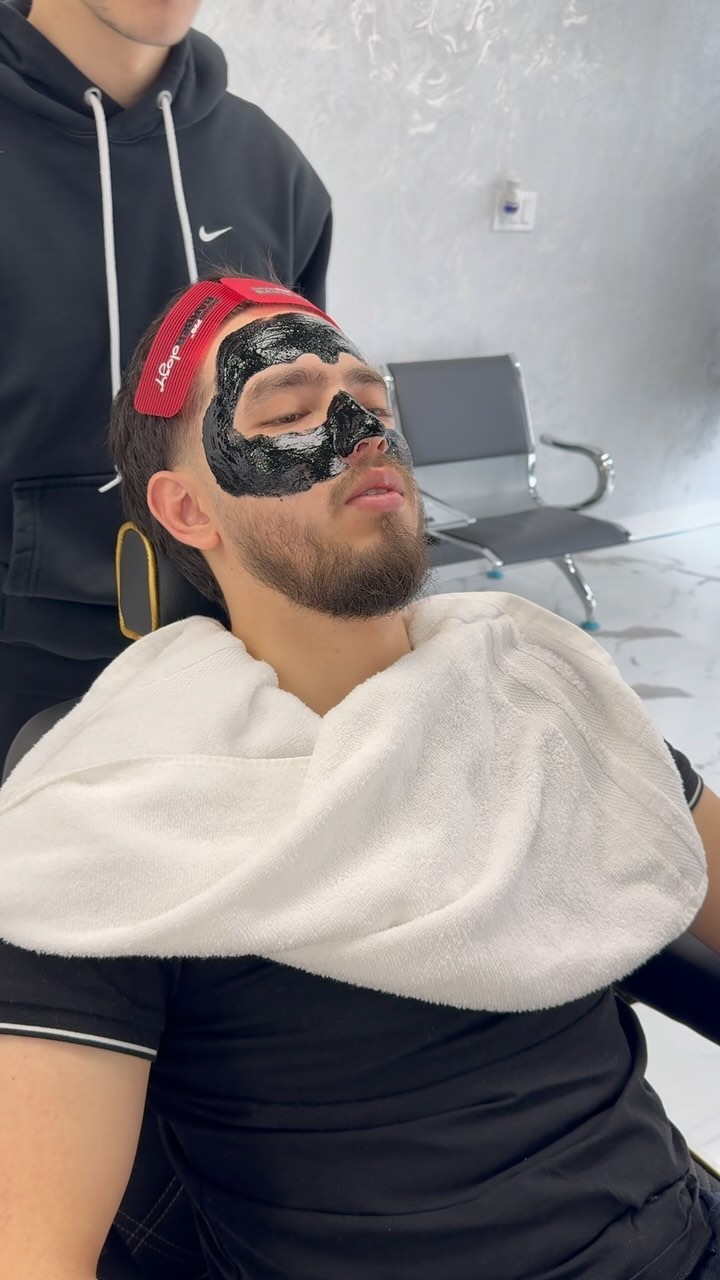 Black mask facial treatment at Eleven Barbers, Brooklyn